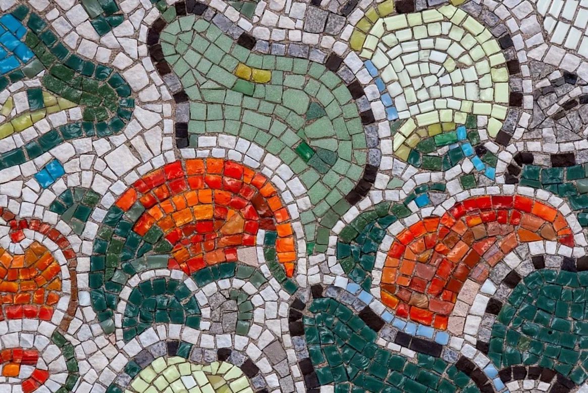 Colourful tile mosaic in orange, green and white